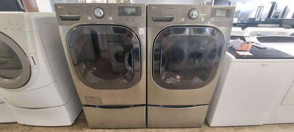 Gray LG Front Load Washer & Gas Dryer Set w/Pedestals & Steam